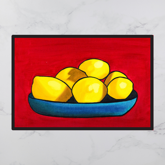 A black framed an oil painting of yellow lemons on a blue plate against a red background