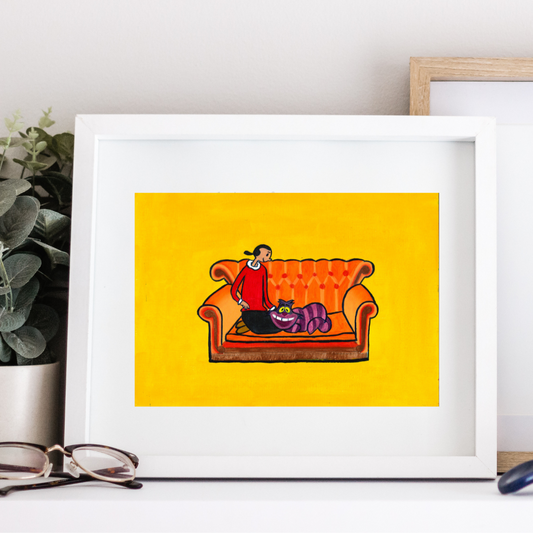 A framed oil painting of Olive Oyl sitting on Friends couch stroking the Cheshire Cat of Alice in Wonderland against a yellow background on a white drawer