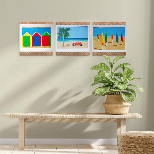 Three framed oil pastel paintings of beach scenes