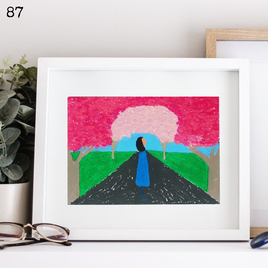 A white framed oil pastel painting of blue woman silhouette under cherry blossoms