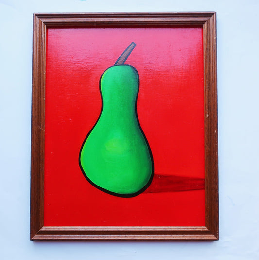 An oil painting of a green pear on a red background in a thrifted frame