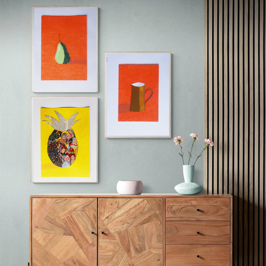 Three framed oil pastel paintings with orange and yellow background in a boho decor 