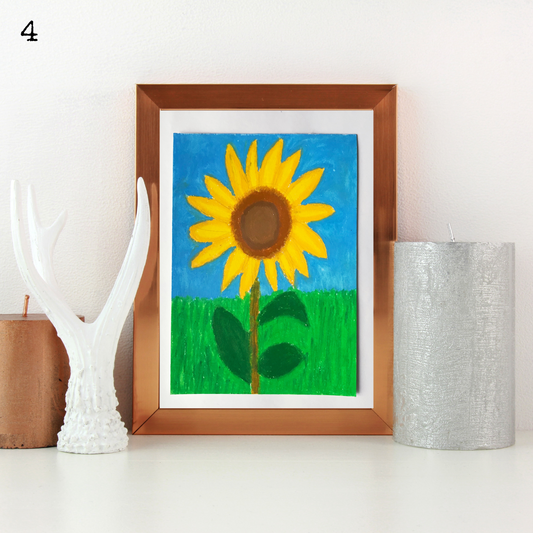 A wooden framed oil pastel painting of a sunflower in a green field under the blue sky