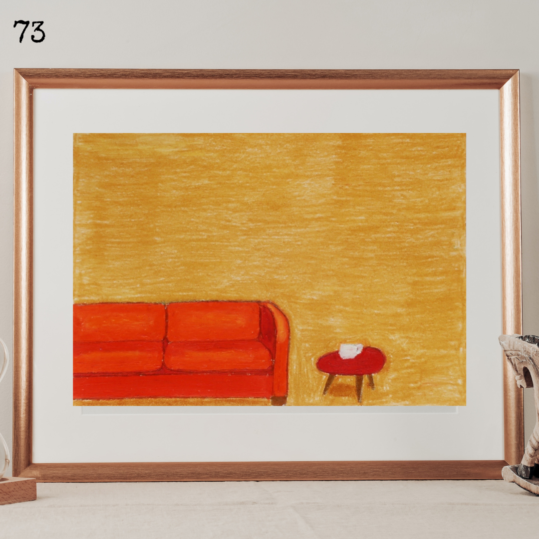 A framed oil pastel painting of an orange vintage sofa