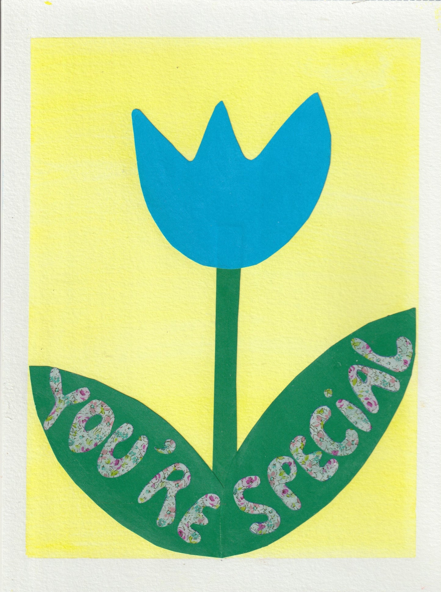 A collage of a blue tulip with the words you're special written on its green leaves