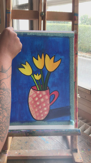 Unwrapping a happy painting of yellow tulips