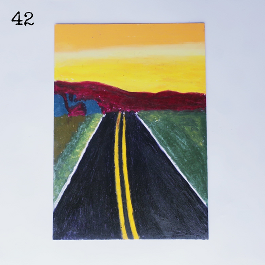 An oil pastel painting of a black road and sunrise