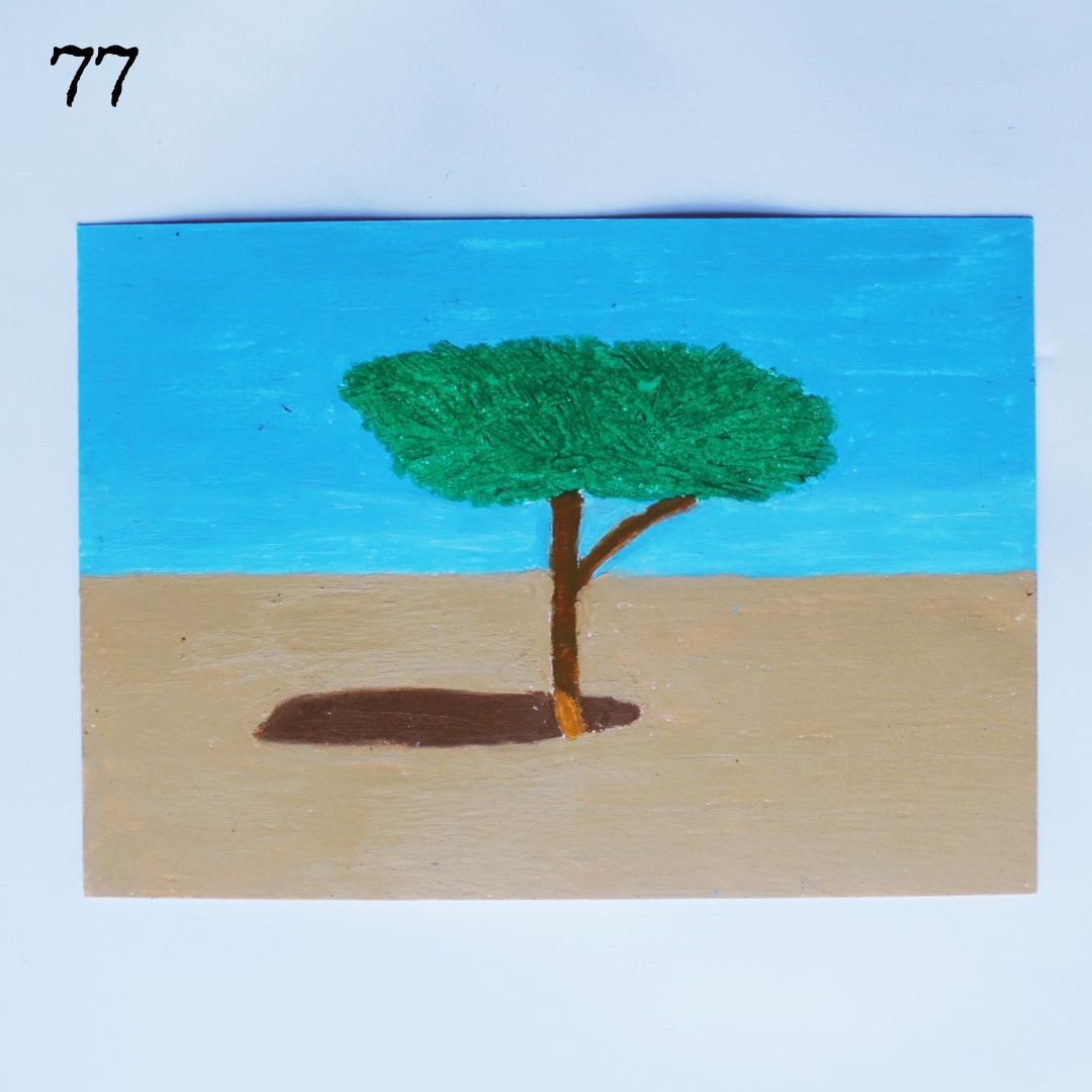 An oil pastel painting of a tree in the desert