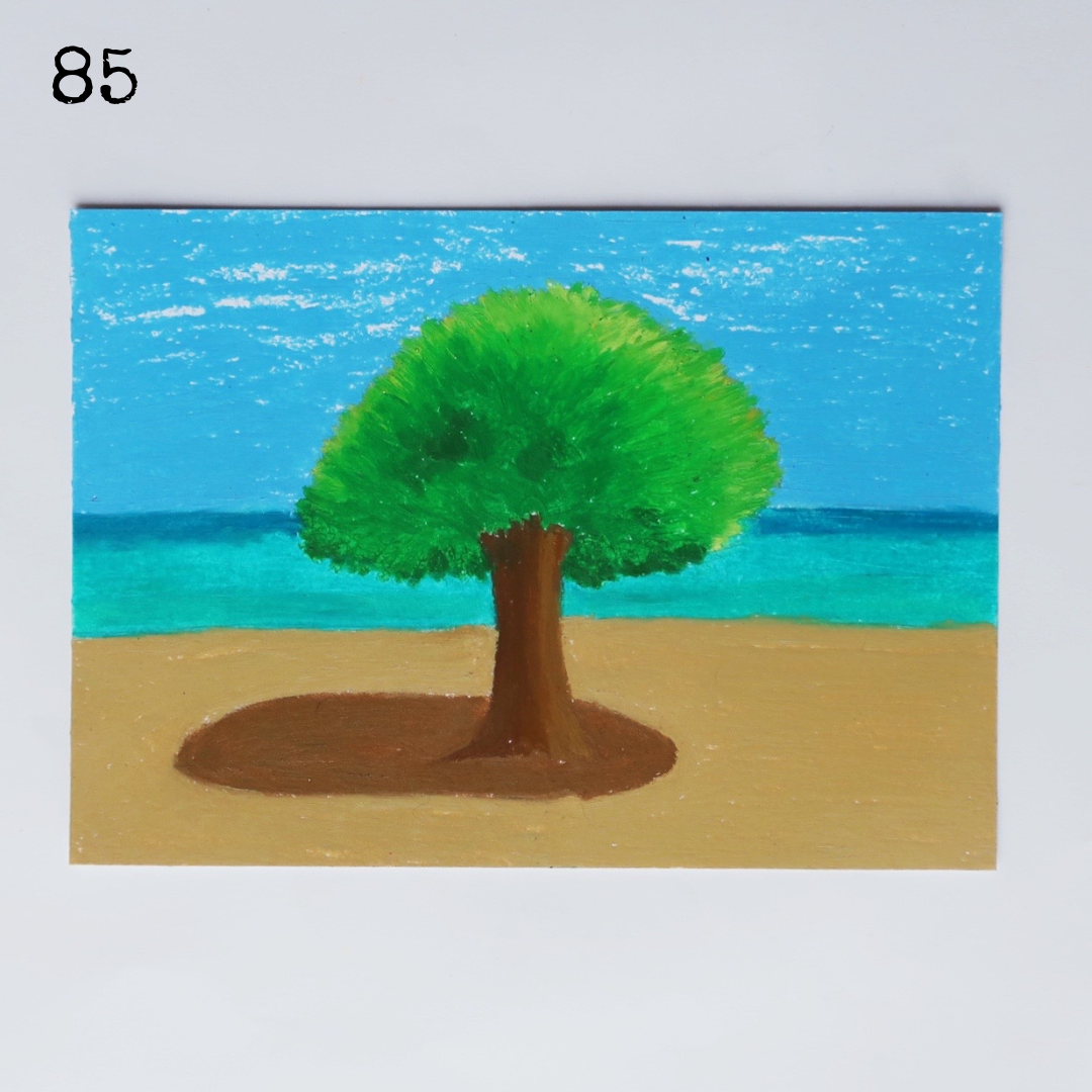 An oil pastel painting of a tree on the beach