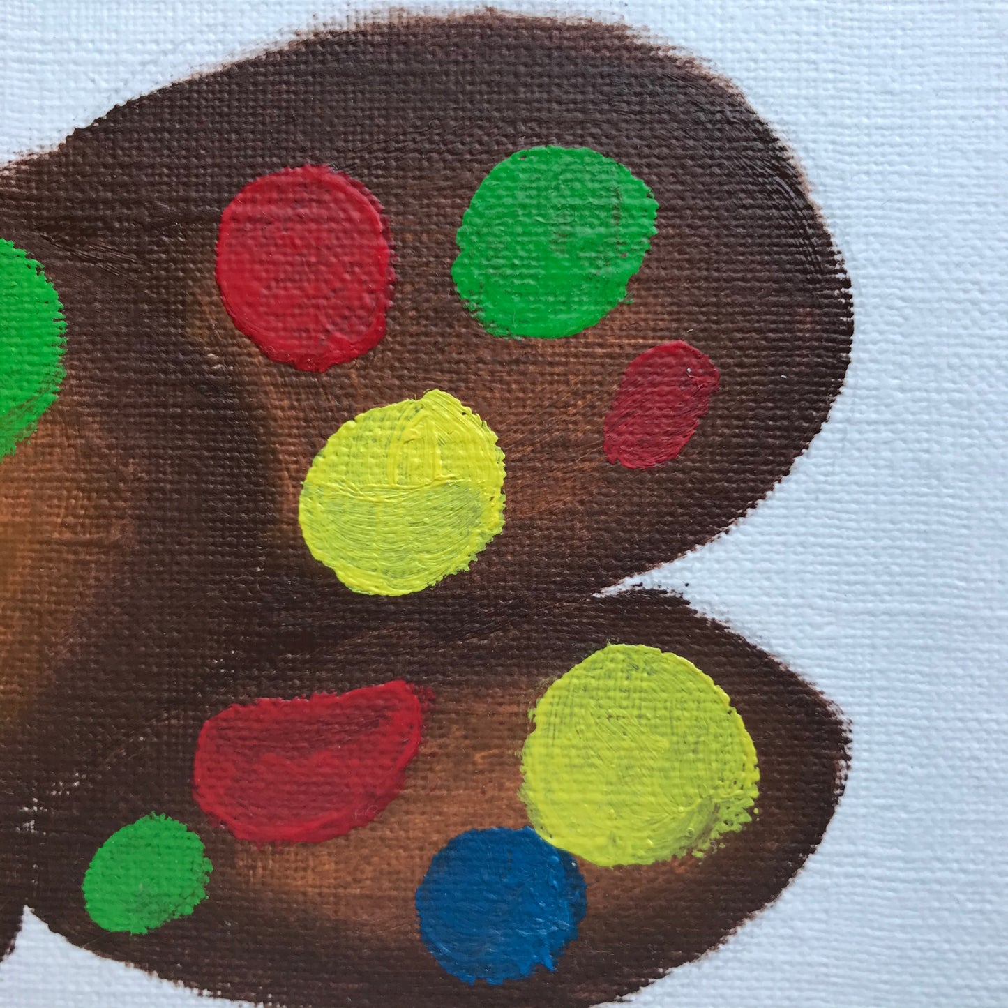 An oil painting of chocolate cookies with colourful M&Ms