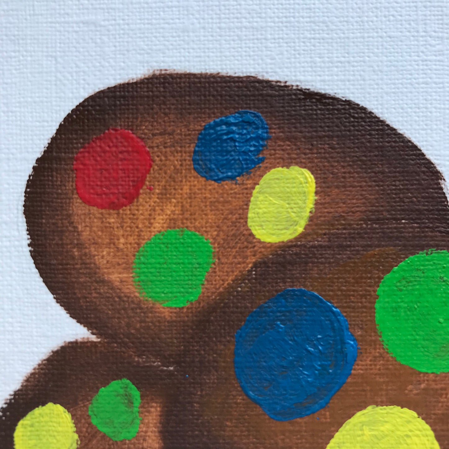 An oil painting of chocolate cookies with colourful M&Ms