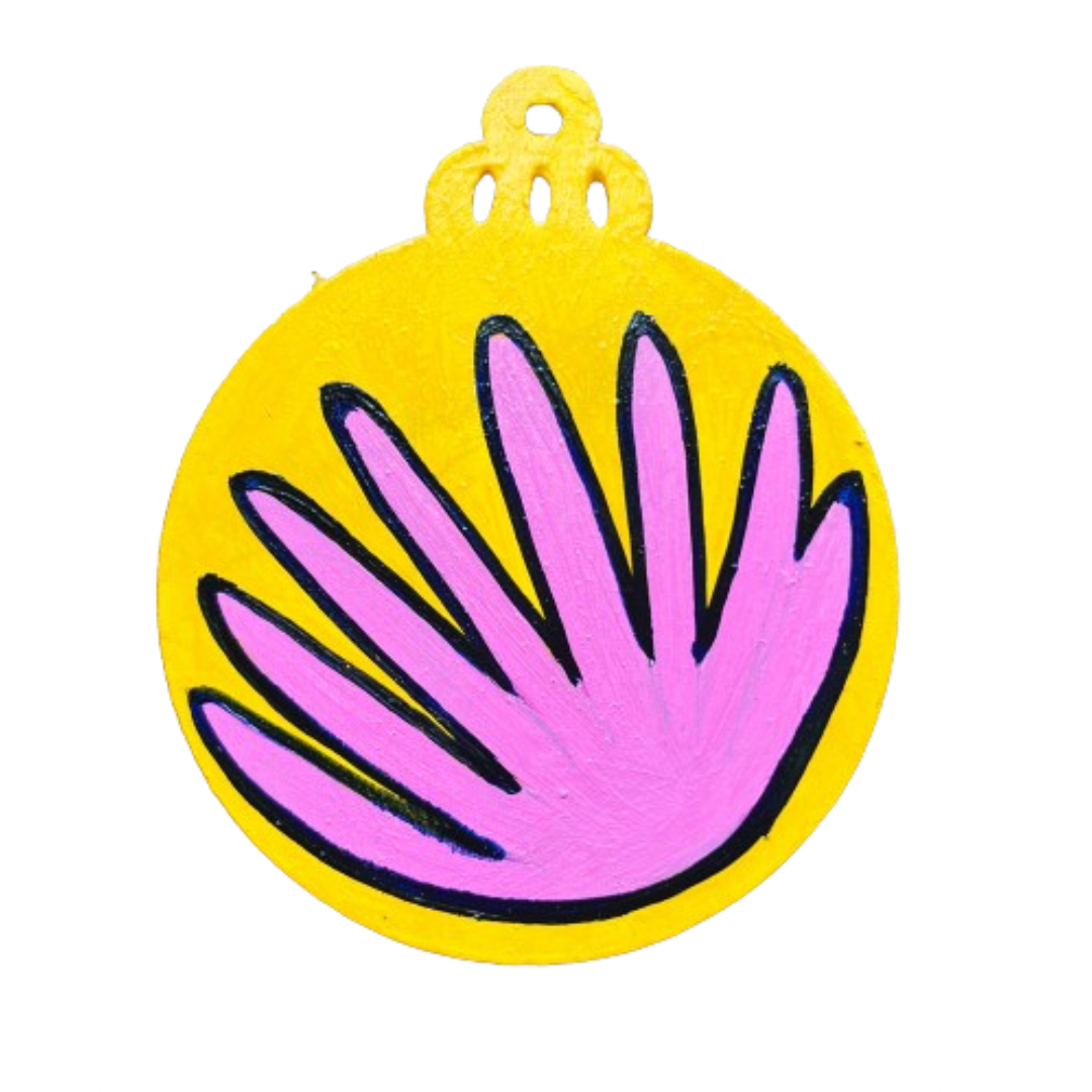 A Christmas ornament representing a pink dahlia flower on a white background