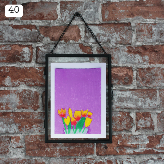 A black framed oil pastel painting of yellow and red tulips against a violet background