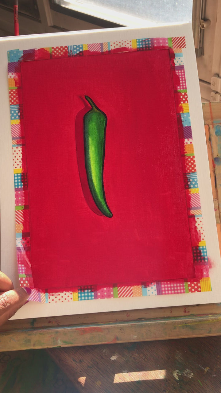 Unwrapping a happy art painting representing a green chili on a red background